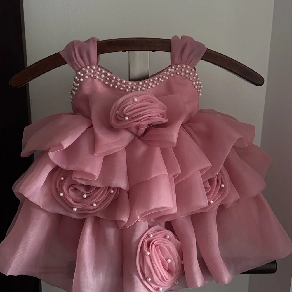 Baby girl Pink Ruffled Dress with Pearl Accents. Perfect for birthday